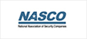 A blue and white logo of the national association of security companies.